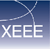 Pixelated blue gradient background with white 'X' and 'EE' text elements, featuring a diagonal line crossing the 'X' and extending to the right.