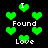 Green pixelated hearts float against a black background with white text reading 'I Found Love' in multiple positions.