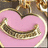 A pink heart-shaped object with a golden border and a golden curved line inside, next to pink text reading "My Obsession" on a black background.