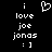 Pixelated white text and symbols on black background: 'i love joe jonas : ]' with a heart symbol above the first 'i'.