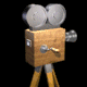 Animated sequence of a wooden film camera icon with silver reels, yellow legs, and rotating crank handle against black background.