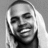 Black-and-white pixelated image of a person with long hair, smiling broadly, overlaid with red 'KISS KISS' text in the lower right.