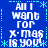 Blue background with white pixelated text reading "All I want for X-Mas is you!" repeated in four quadrants, surrounded by light blue asterisk and dotted line borders.