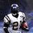 Pixelated image of a football player in white uniform with number 21, holding a red football against dark blue background.