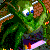 Pixelated green figure with white eyes and blue pupils, holding a pink object against dark foliage background.