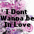 Pixelated image with black text reading "I Don't Wanna Be In Love" over a pink and purple floral background.