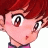 Pixelated anime-style character with red hair and pink cheeks, side profile showing one eye and a small mouth, next to black background with white text.