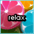 Pixelated image with pink flower, blue water, and orange sky background; black text box containing 'relax' in white lowercase letters.