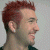 A 50x50 pixel animated contact sheet showing two frames of a buddy icon: left frame features a person with red hair in profile, right frame displays green text on dark background.