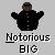 Pixel art image of two figures with text labels, one in black clothing with arms outstretched and another with red hair and brown clothing holding a microphone.
