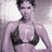 Static 48x48 pixel icon of a person in black bikini top against purple-toned background with visible dithering and low-resolution rendering artifacts.