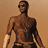 4-frame contact sheet of a shirtless man in sunglasses with varying poses and angles against a solid brown background.