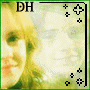 A pixelated image of a person with blonde hair and green eyes, framed by decorative black border elements including plus signs and cross symbols.