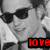 Pixelated grayscale image of a person wearing dark sunglasses and a light-colored shirt, with red text reading 'LOVE' in the bottom right corner.