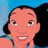 Pixelated cartoon-style face with light brown skin, large eyes, and a wide smile showing white teeth, set against a blue background with dark hair on the right.
