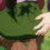 Animated sequence showing two figures in a grassy outdoor setting with one figure lifting another's skirt.