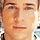 Pixelated close-up of a person's face with warm skin tones and neutral expression on static 40x40 icon frame.