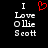 Pixelated text 'I Love Ollie Scott' with a red heart symbol above the word 'Love', displayed on black background.