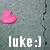 A static image shows a pink heart-shaped object on a gray background with a vertical crack, accompanied by the text 'luke:]' in white pixelated font.