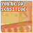 identical pixelated icons showing 'YOU'RE 50 SENSITIVE' text over a blurred orange and yellow background with horizontal stripes