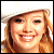 six showing a person with blonde hair and white cap, some display text like 'oh how I love Hilary!' and 'Hilary SUCKS' in various colors