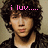 Pixelated image of a person with curly hair wearing dark clothing, featuring pink text overlays in different positions across four