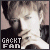 Pixelated image of a person with light hair and dark clothing, featuring text reading "GACKT FAN" in the lower-left corner.