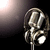 A pixelated microphone icon with metallic silver and gray tones against a dark gradient background fading to light on the left.