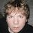 A person with light brown hair and fair skin appears in three with text overlays CA, R, and TY above their head against a gray background