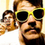 Three pixelated figures with brown hair and yellow sunglasses, one in front of two others against a light background.