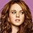Pixelated image of a person with long brown hair against purple background, paired with blue text blocks reading 'I Have This Theory..', 'If You Cut She'll Look Off ALL Her Hair Like a British Man!'