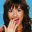 A pixelated image of a woman with long dark hair against a blue background, with a red text bubble reading "OMG!" appearing on the right side.
