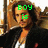 A four- shows a person with long brown hair in black jacket and white shirt, with green pixelated text changing