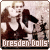 Pixelated static image of a band logo featuring silhouetted figures and text on a light background with brown border.