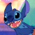 Pixelated static image of a blue cartoon character with large ears, black eyes, and an open mouth showing pink tongue and teeth against a colorful gradient background.