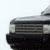 Animated sequence showing a dark SUV with visible front grille, headlights, and wheel in two distinct frames.