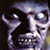 Pixelated grayscale face with wide eyes and open mouth on dark background, adjacent to green text reading 'Original Icons .com' in bright green pixel font.