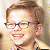 A 50x50 pixel animated contact sheet showing two frames: a person with light brown hair and glasses on the left, and green text reading "Original Icons .com" on a dark green background on the right.