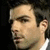 A man's face in profile view with dark hair, light skin, and a white shirt collar, shown in four with subtle facial expression changes