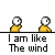 Yellow cartoon character with large white eyes and black pupils performs various actions above text reading "I am like The wind" on gray background.