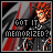 Pixelated character with orange hair and green eyes, wearing dark clothing against a red-and-gray striped background with text overlay.