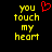 Yellow pixelated text 'you touch my heart' on black background with red heart symbol above 'you' on left side.