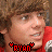 Pixelated close-up of a person with brown hair wearing red clothing, featuring red pixel-art text reading 'RYAN' with heart symbols at both ends.