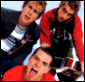 repeated images showing three people in red and dark clothing with one person sticking out their tongue, overlaid with evolving white text