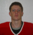 25 identical portraits showing a person in a red jersey with black and white trim, each with slight pixelation and color variations across the