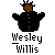 Pixelated icon of a figure with brown skin and black hair wearing a black buttoned jacket, arms outstretched, with 'Wesley Willis' text below.