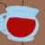 A light blue pitcher filled with red liquid appears on a brown background, then transforms into a smiling character holding the same pitcher.