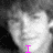 Black-and-white pixelated image of a person with curly hair, overlaid with pink text elements in different positions across the frame.