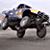 Pixelated static image of a dark-colored vehicle with visible headlights and wheels on a light background.