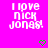 Pixelated text on bright pink background with green heart symbols, showing 'I love Nick Jonas!' in white block letters.
